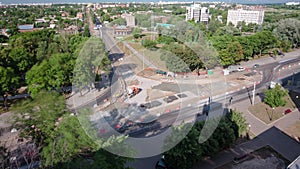 Road construction site with tram tracks repair and maintenance aerial timelapse.