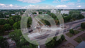 Road construction site with tram tracks repair and maintenance aerial timelapse.