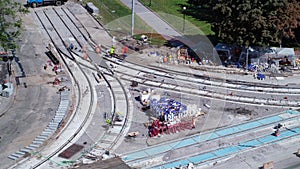 Road construction site with tram tracks repair and maintenance aerial timelapse.