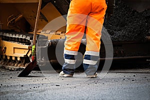 Road construction worker and shovel