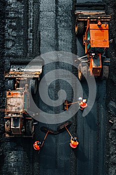 Road construction workers teamwork tarmac laying work