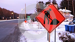 Road construction workers warning sign
