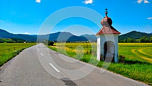 Road in the countryside of Slovakia with mountains in the background