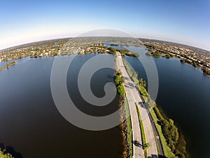 Road crossing lakes aerial view