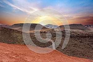 A road crossing the Timanfaya National Park at sunset. Lanzarote, Canary Islands, Spain.