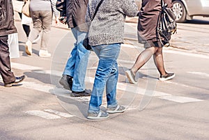Road crossing with women, pedestrian feet