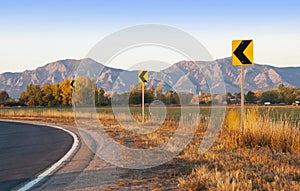 Road Curve Signs with Scenic Backdrop