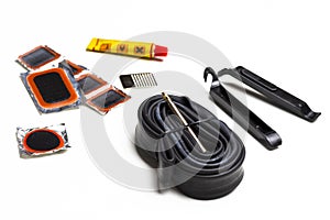 Road Cycling Concepts. Complete Set of Road Bike Inner Tube Repairing Kit Against White