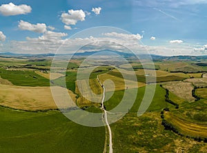 Road with cypress trees in the Val d orcia (Orcia Valley) near Pienza in Tuscany, Italy - cypress trees along the famous white