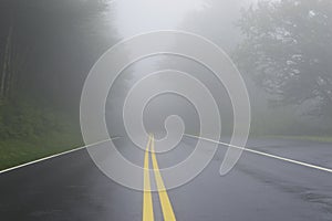 Road Danger Disappearing Into Fog