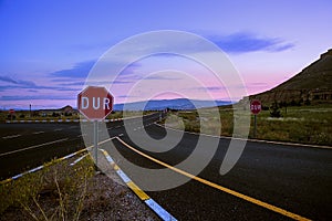 Road in the dawn against the blue sky in Turkey. Sunrise, field, mountains, trees in the morning in Cappadocia.