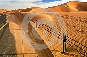 A road through a desert dunes