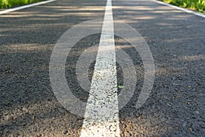 Road with a dividing strip,the concept of movement, gray texture