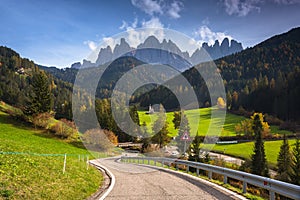 Road in Dolomites with the St. John& x27;s in Ranui Chapel, Santa Maddalena. Italy