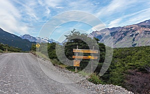 A road in El ChaltÃÂ©n city, and the signboard for the bikepath. Patagonia Argentina. photo