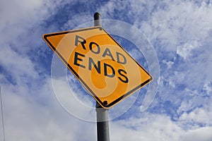 Road ends traffic sign under dramatic sky