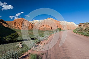 Road and eroded mountains in Kyrgyzstan