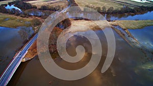 Road through filed tide time, aerial flight view Lithuania