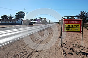 Road fire safety sign on highway in outback