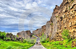 Road in a fissure between tectonic plates in the Thingvellir National Park - Iceland photo