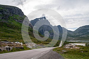 Road in a fjord between mountains, Lofoten, Norway