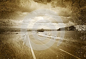 Road and flat landscape in sepia