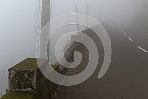 Road in a fog in a cloud in the mountains of Madeira Island, Portugal