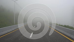 The road in the fog. First-person view, walking on the road.