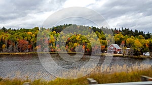 On the road, Front of the lake, autumn colors, Tadoussac Quebec