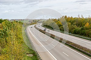 Road and german highway or autobahn, agricultural fields and meadows