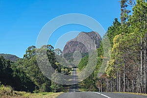 A road through the Glass Mountains of Queensland Australia that looks like it is headed straight toward a looming ancient volcanic