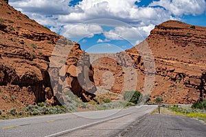 Road going through the beautiful red rocks of Dubois, Wyoming through the Shoshone National Forest