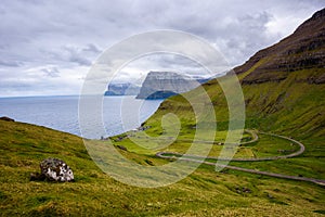 Road going to Trollanes village on Kalsoy in Faroe Islands, Denmark photo