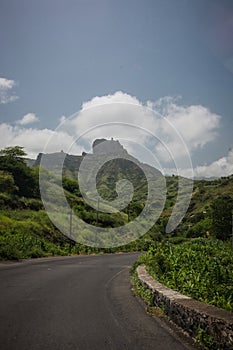 Road through Green plains and mountains with view over the city of Assomada on the island of Santiago, Cabo Verde islands photo