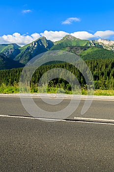 Road in green summer landscape of Tatra Mountains in Zdiar village, Slovakia