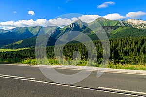 Road in green summer landscape of Tatra Mountains in Zdiar village, Slovakia