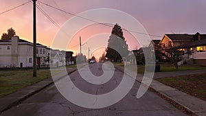 Road and Homes in Suburban Neighborhood, Sunset. Fall Season. Burnaby, British Columbia, Canada