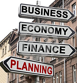 The road indicator on the arrows of which is written - business, economics, finance and PLANNING