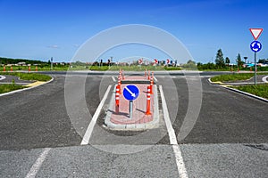 Road infrastructure and road signs before the roundabout