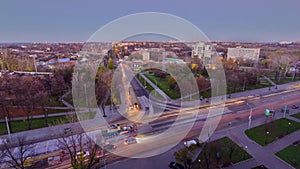 Road intersection with reconstructed tram tracks aerial panoramic day to night timelapse.