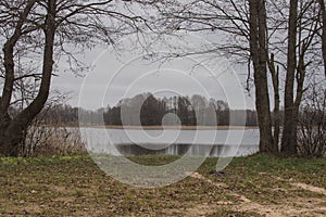 The road by the lake on a cloudy rainy day