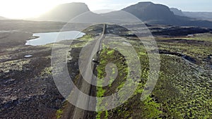 Road landscape in Iceland, beautiful volcanic nature in sunny weather, travel destination gravel f road