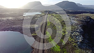 Road landscape in Iceland, beautiful volcanic nature in sunny weather, travel destination gravel f road