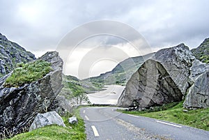 Road through the landscape with a lake in the background, Ireland