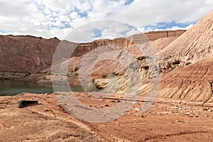 Road leading down to the deep blue Hidden Lake near the Timna park,surrounded by mountains near Eilat city, Arava Valley,