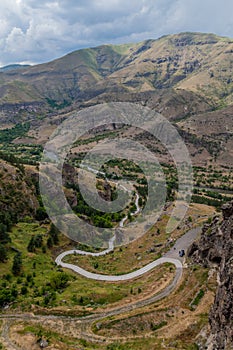 Road leading from Mtkvari river valley to the cave monastery Vanis Kvabebi carved into a cliff, Georg