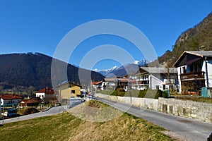 Road leading throug Modrej village near Most na Soci in Severna Primorska