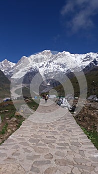 A road leading to icy mountains