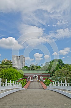 Road leading to old gate and modern city