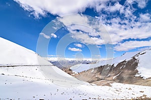 On the road in Leh Ladakh landscape.Khardung La pass.Road on snow mountain in northern India.